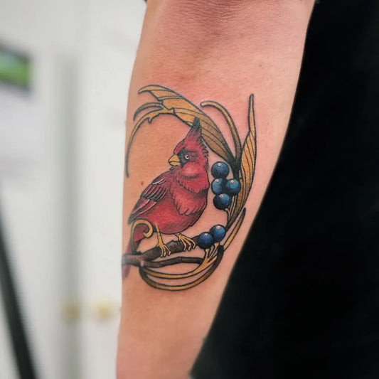 Medium Neo Traditional Cardinal with Grapes Tattoo on Women Arm by @tattooist_brooke