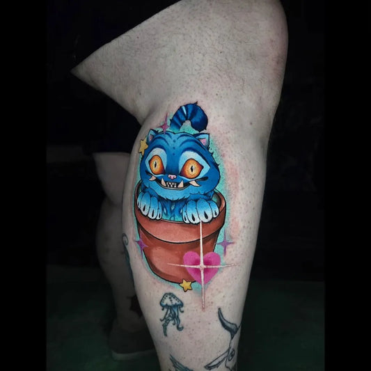 Medium Neo Traditional Cheshire Cat in Pot with Jellyfish Tattoo on Women Calf by @baka_tattoos