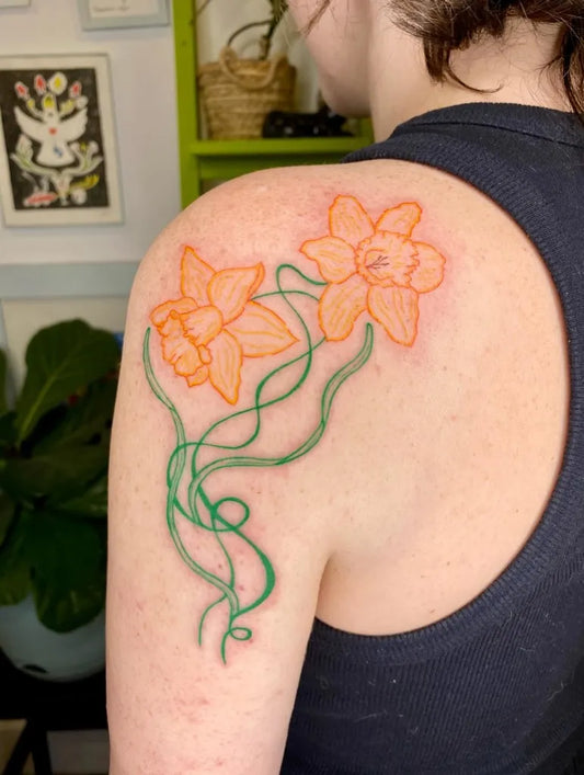 Medium Neo Traditional Daffodils and Vines Tattoo on Women Shoulder by @emilys_tattoo_parade