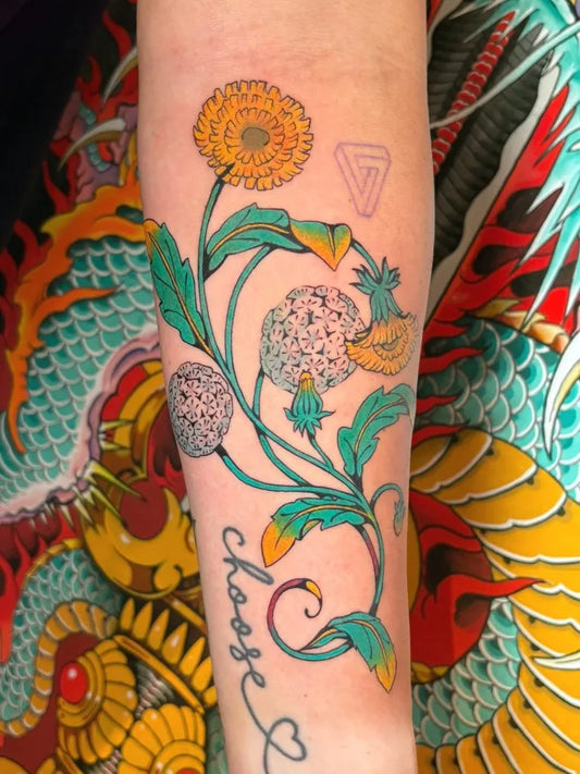 Medium Neo Traditional Dandelion Flower Text Tattoo on Women Arm by @elliediamondtattoos