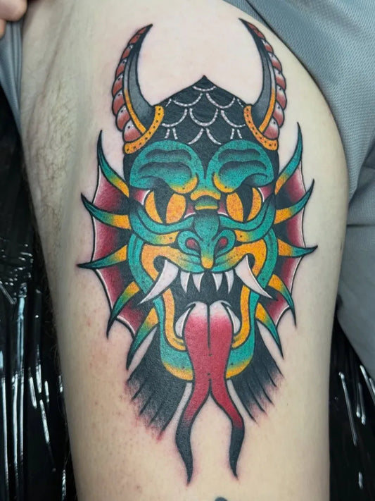 Medium Neo Traditional Demon Mask Tattoo on Men Thigh by @jamie_95_tattoos