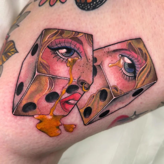 Medium Neo Traditional Dice with Faces Tattoo on Women Arm by @paulacastletattoos