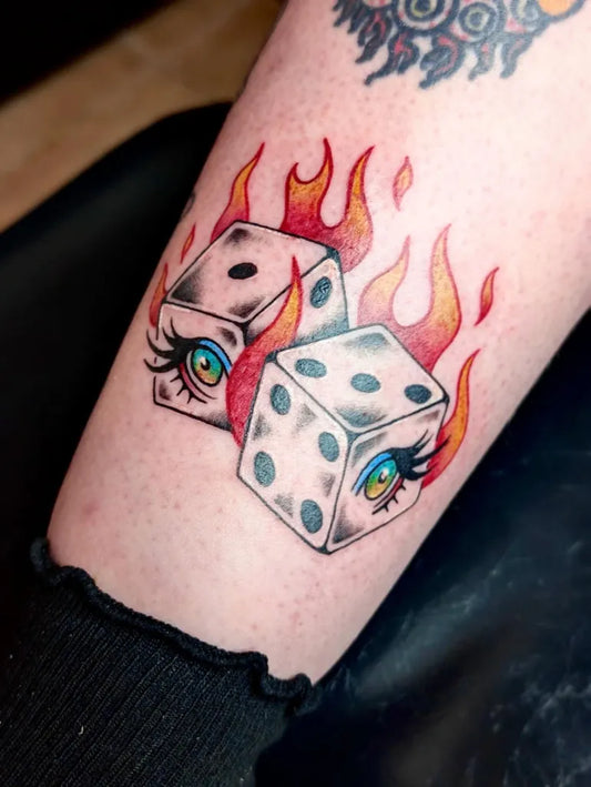 Medium Neo Traditional Dice with Flames Tattoo on Women Arm by @bloodmilkandhoney