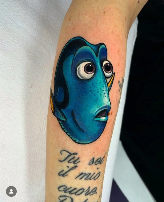 Medium Neo Traditional Dory Fish Cartoon Tattoo on Women Forearm by @metropolis_shop_roma