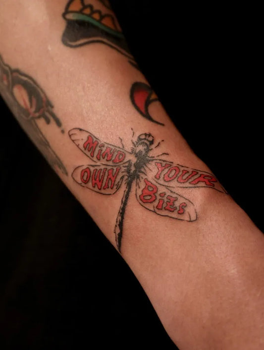 Medium Neo Traditional Dragonfly with Text on Women Arm Tattoo by @fish_tattoo.hk