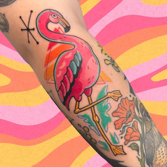 Medium Neo Traditional Flamingo and Flowers Tattoo on Women Arm by @ink.grinder