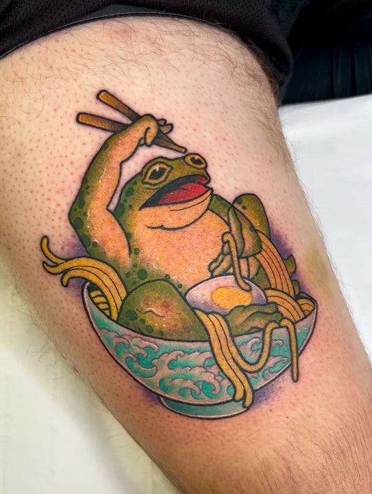 Medium Neo Traditional Frog Eating Noodles Tattoo on Men Thigh by @sjlant