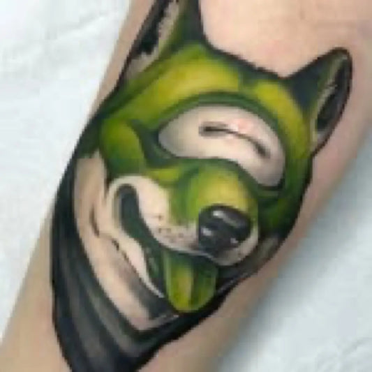 Medium Neo Traditional Green Husky Horror Tattoo on Men Arm by @ryanwildtattoos