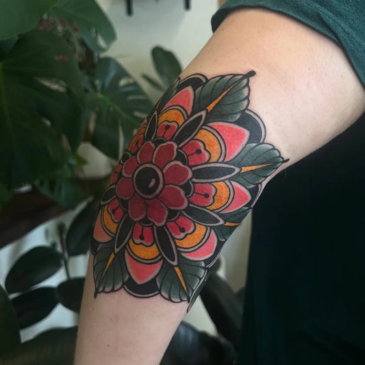 Medium Neo Traditional Mandala Flower Tattoo on Women Elbow by @rennietattoo
