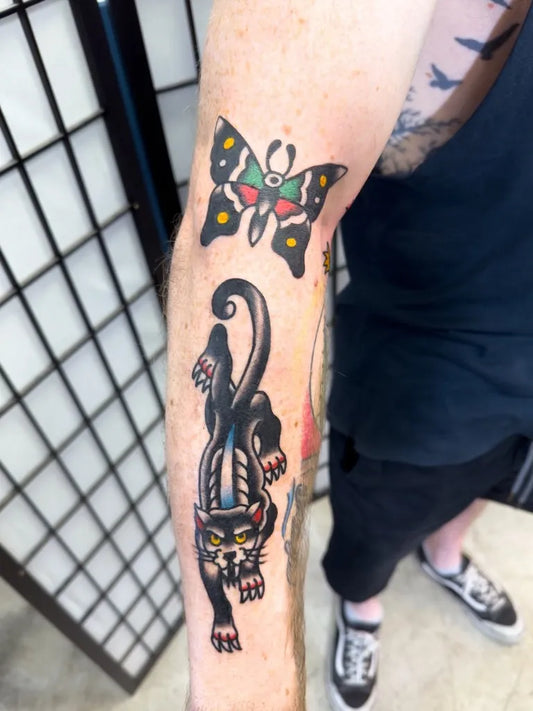 Medium Neo Traditional Panther and Butterfly Tattoo on Men Arm by @lukeetho