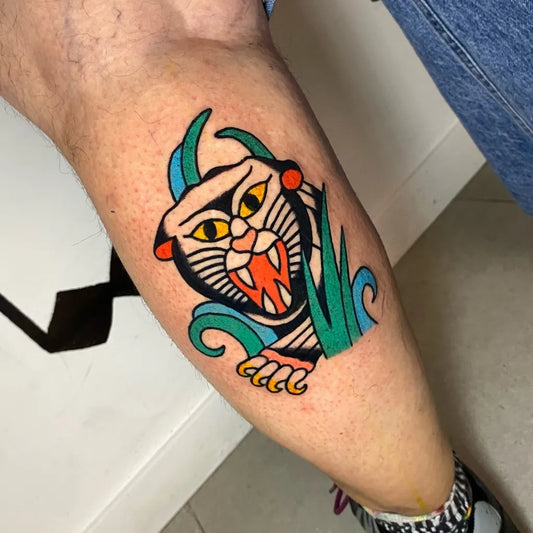 Medium Neo Traditional Panther with Grass Tattoo on Men Leg by @sile.34