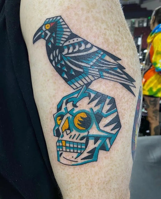 Medium Neo Traditional Raven and Skull Tattoo on Men Bicep by @sweetneedlestattoo