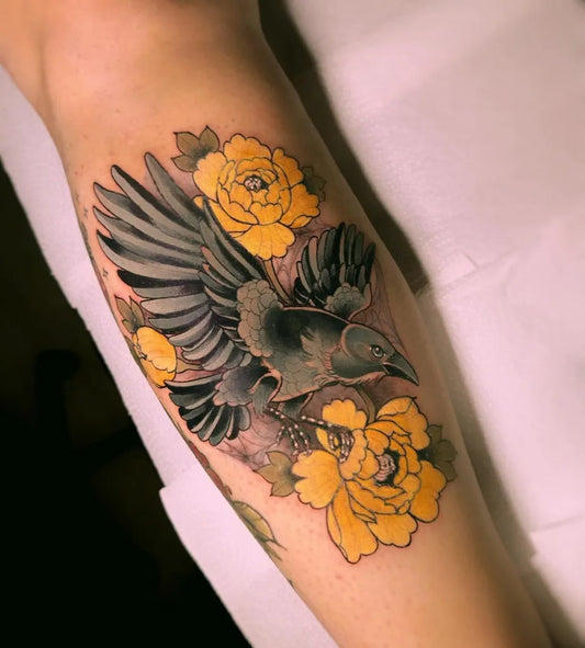 Medium Neo Traditional Raven and Yellow Peonies on Women Arm Tattoo by @kokoroinks