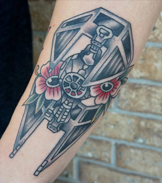 Medium Neo Traditional Star Wars TIE Fighter with Flowers Tattoo on Women Arm by @lauren_tattoos
