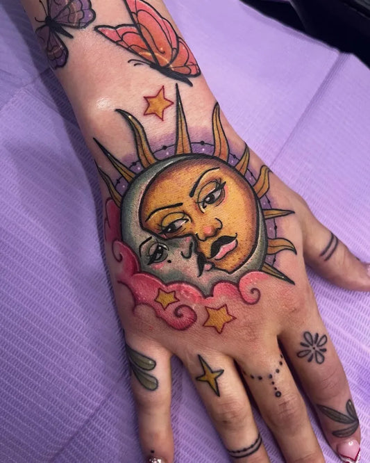 Medium Neo Traditional Sun and Moon on Women Hand Tattoo by @sabrinaspicyhands
