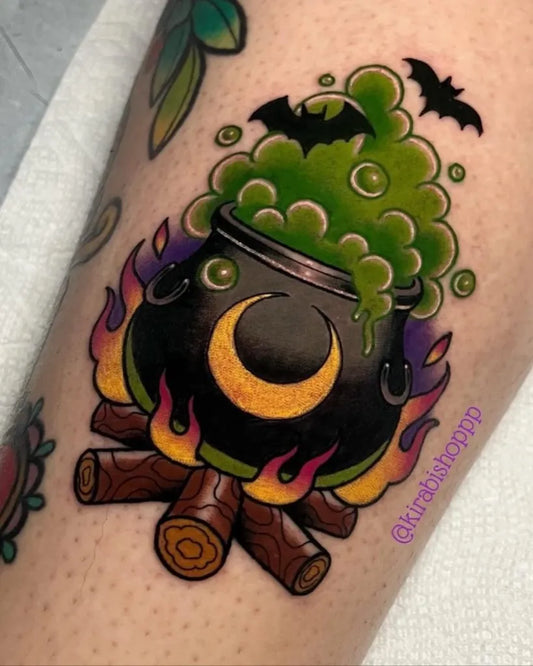 Medium Neo Traditional Witch Cauldron with Bats and Fire Halloween Tattoo on Women Leg by @kirabishoppp