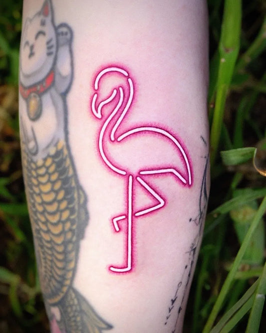 Medium Neon Winking Cat and Flamingo Tattoo on Women Arm by @pureum_tattoo