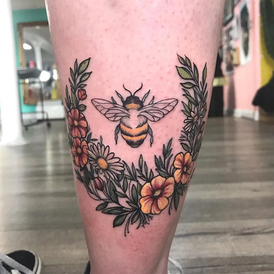 Medium Neotraditional Bee and Flowers Tattoo on Women Calf by @beckletattoo