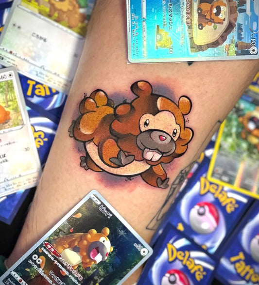 Medium Neotraditional Bibarel Pokemon Tattoo on Men Leg by @delafe_tattoo