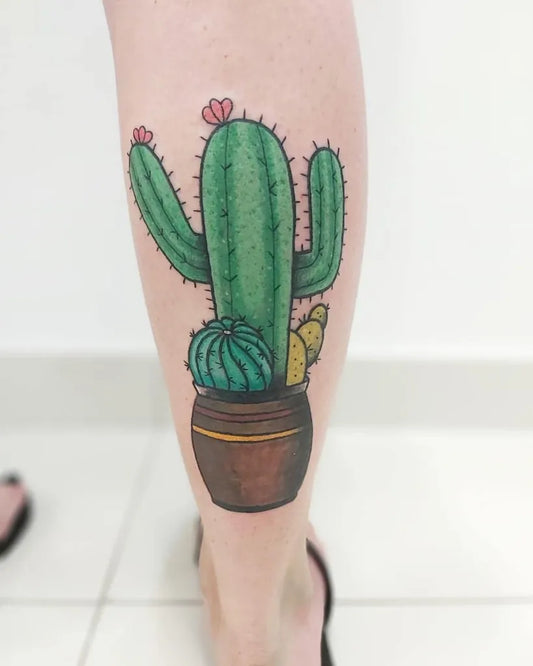 Medium Neotraditional Cactus in Pot Tattoo on Women Leg by @truecolourstattoostudio