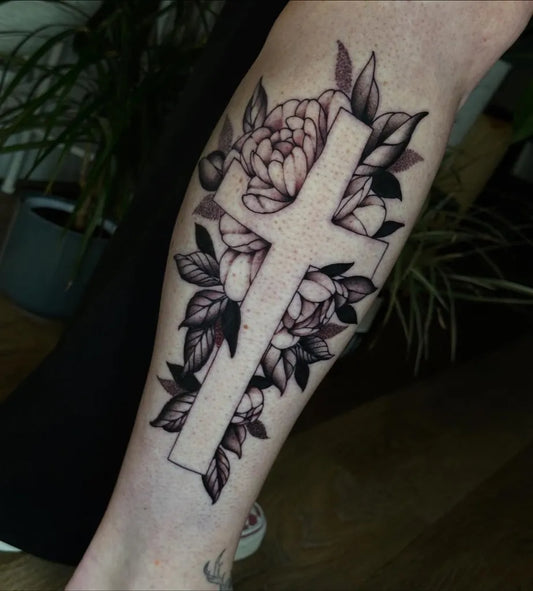 Medium Neotraditional Cross and Peony on Women Leg Tattoo by @jordancaseytattoo