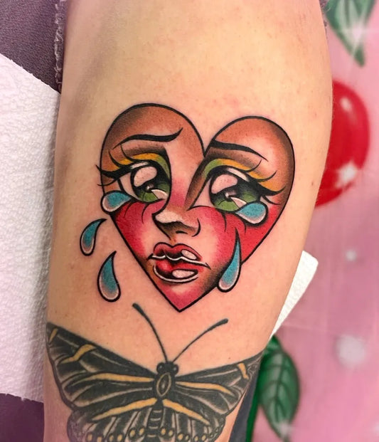 Medium Neotraditional Crying Heart Butterfly on Women Arm Tattoo by @sammyvanhiggins