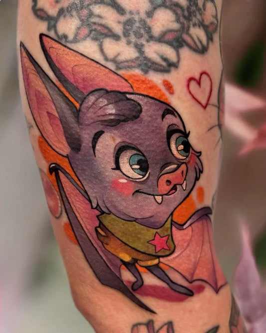 Medium Neotraditional Cute Bat Heart Flower Cartoon Tattoo on Women Arm by @petjaevlogieva