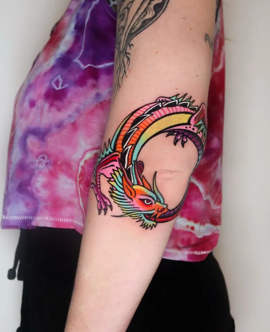 Medium Neotraditional Ouroboros Dragon Tattoo on Women Arm by @spiritvoyager_tattoo