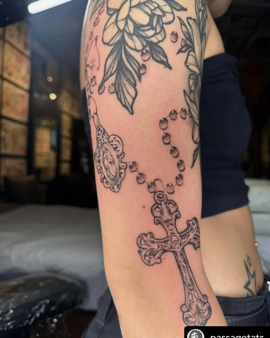 Medium Neotraditional Rosary Cross on Women Arm Tattoo by @oceanic_art