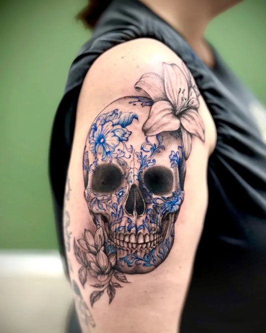 Medium Neotraditional Skull Lily on Women Arm Tattoo by @rebecka_tattoos