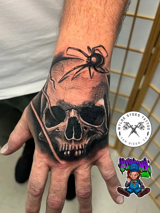 Medium Neotraditional Skull Spider on Men Hand Tattoo by @wyldesydes
