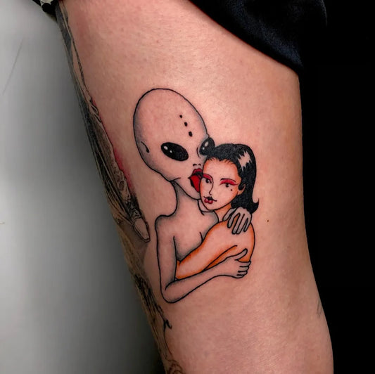 Medium New School Alien and Woman Tattoo on Women Arm by @kissbangroma