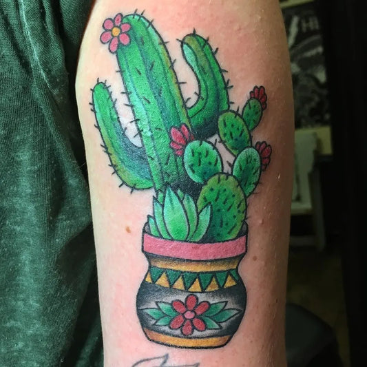 Medium New School Cactus Flower Pot Tattoo on Women Arm by @chelsbells_tattoos