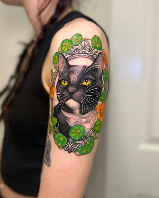 Medium New School Cat with Lotus and Crown Tattoo on Women Arm by @claireellentattoo