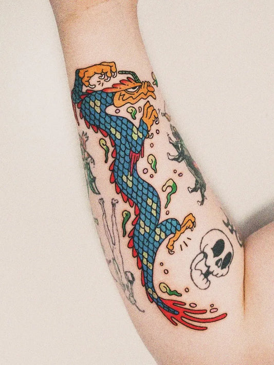 Medium New School Dragon Skull Tattoo on Men Arm by @pillowtattooer
