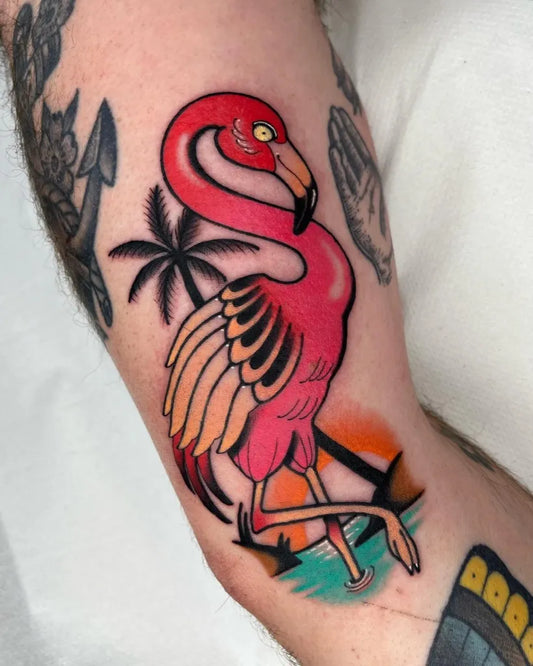 Medium New School Flamingo Palm Tree Sunset Tattoo on Men Arm by @sophieannisontattoo
