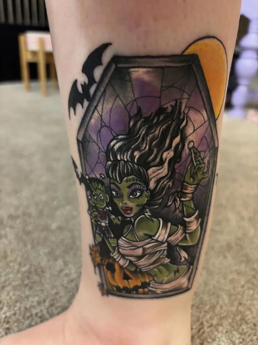 Medium New School Frankenstein Bride in Coffin Halloween Tattoo on Women Leg by @randee_green_author