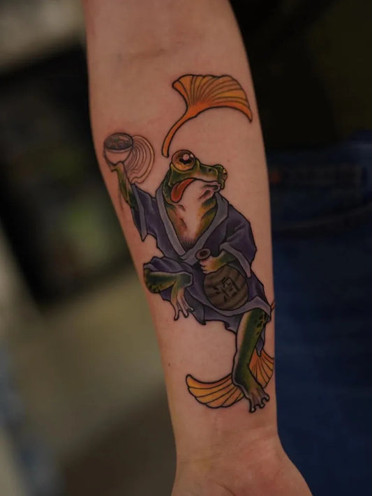Medium New School Frog with Lotus Tattoo on Women Arm by @ink_kuki7
