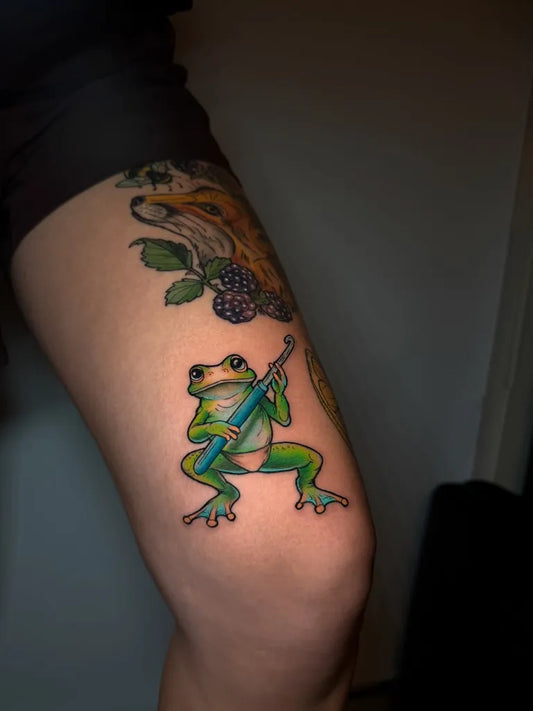 Medium New School Frog with Saxophone Tattoo on Women Thigh by @jpg_tattoo