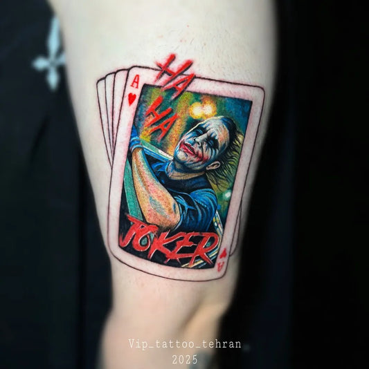Medium New School Joker Playing Cards on Men Arm Tattoo by @vip_tattoo_tehran