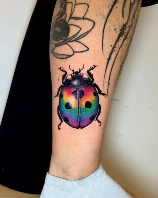 Medium New School Ladybug Tattoo on Women Leg by @tetar_ttt