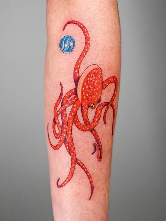 Medium New School Octopus and Orb Tattoo on Men Arm by @tattoojune