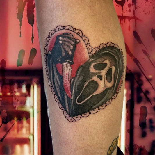 Medium New School Scream Mask Heart Horror Tattoo on Women Thigh by @sacred_grove_tattoo