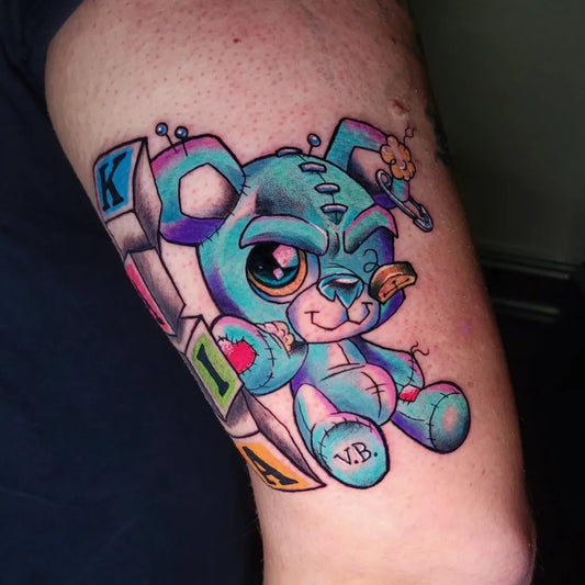 Medium New School Stylized Blue Teddy Bear with Building Blocks Tattoo on Men Arm by @xiodoodles