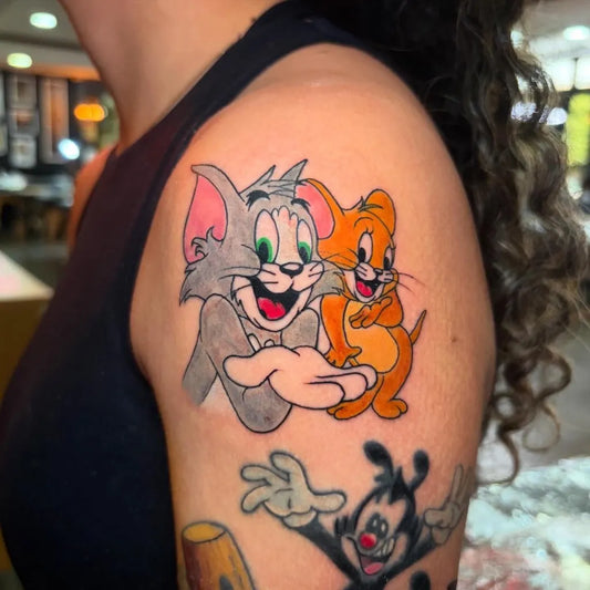 Medium New School Tom and Jerry and Mickey Mouse Cartoon Tattoo on Women Arm by @chejososa