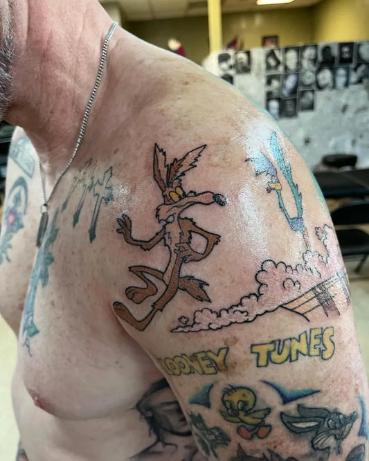 Medium New School Wile E Coyote and Tweety Cartoon Tattoo on Men Shoulder by @nreeltattoo