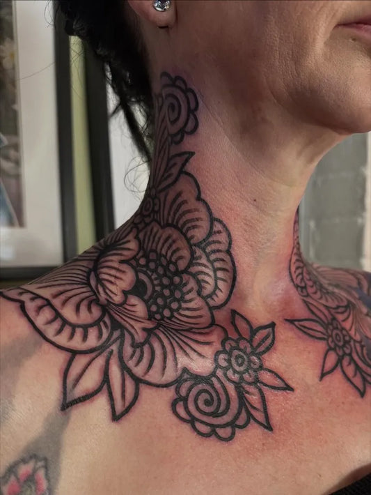 Medium Ornamental Floral Design Tattoo on Women Neck by @sophiegibbonstattooer