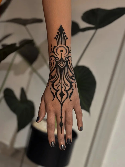 Medium Ornamental Floral Motif Tattoo on Women Wrist by @cahhks