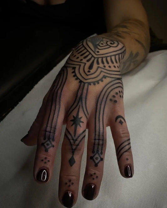 Medium Ornamental Geometric Motifs Tattoo on Women Hand by @marak.la.rouge