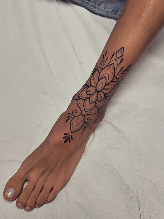 Medium Ornamental Mandala Floral Tattoo on Women Ankle by @norinatattoo